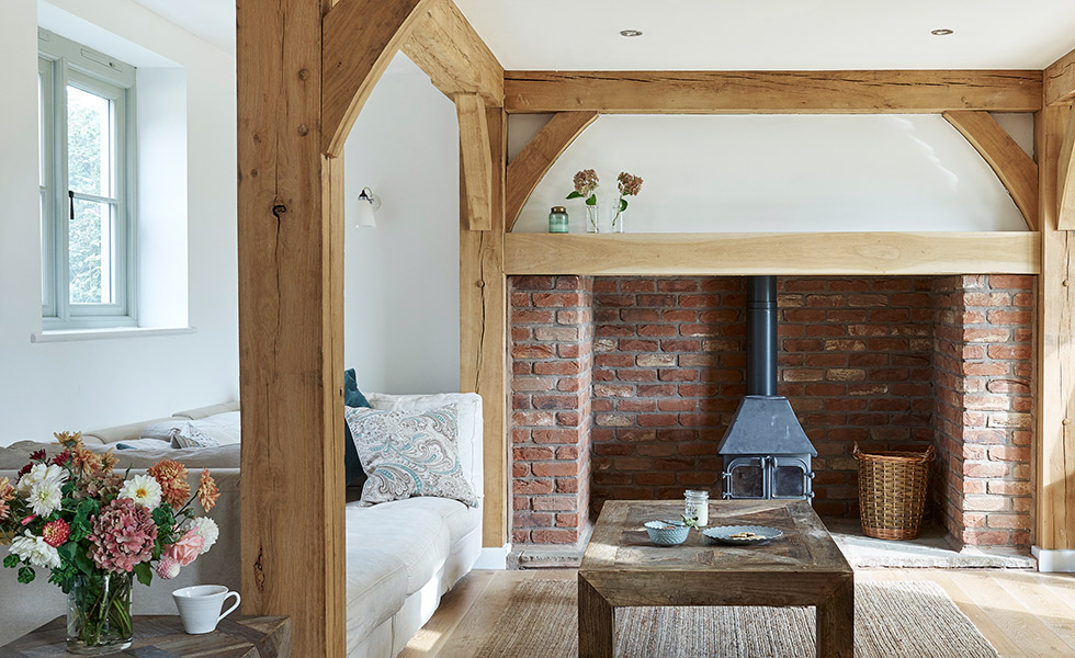 budget-oak-frame-home-living-room-with-woodburner-and-beams