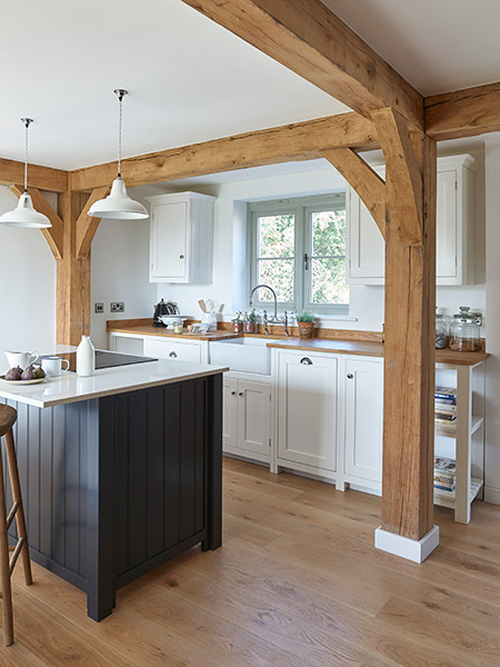 budget-oak-frame-home-kitchen-with-dark-blue-island