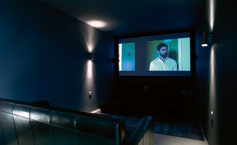 A cinema room offers prime entertainment space in a contemporary self-build by Annie Martin Architect