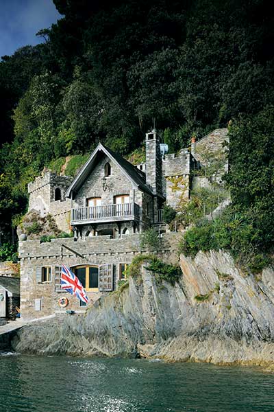 A stone self build on the coast is built to look like an old ruin