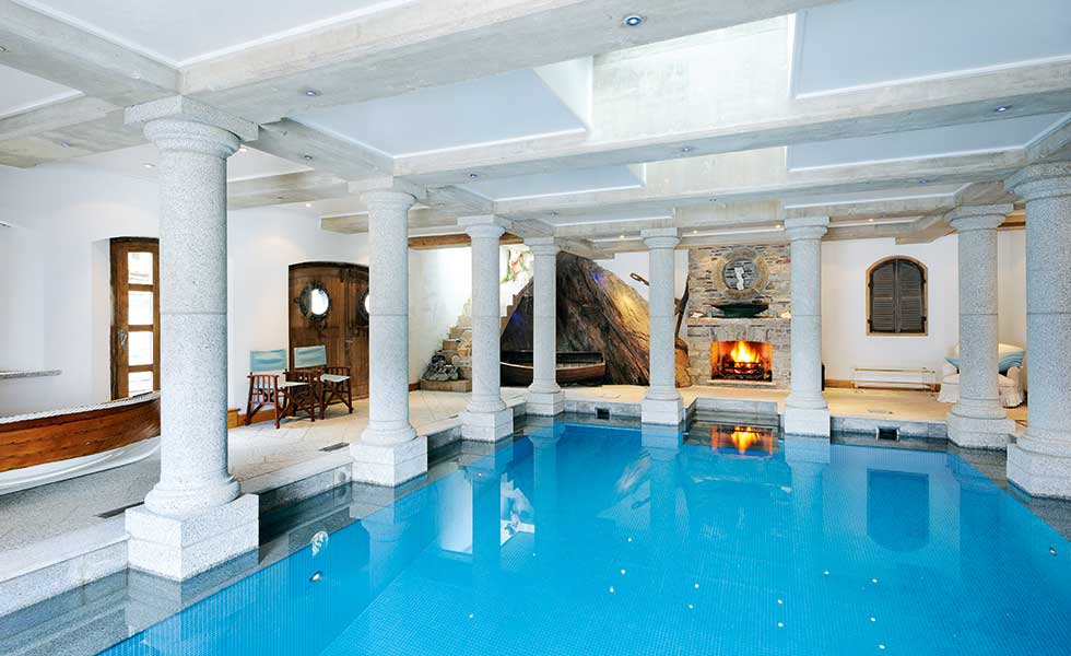 A swimming pool takes up space on the lower ground floor of this coastal self build