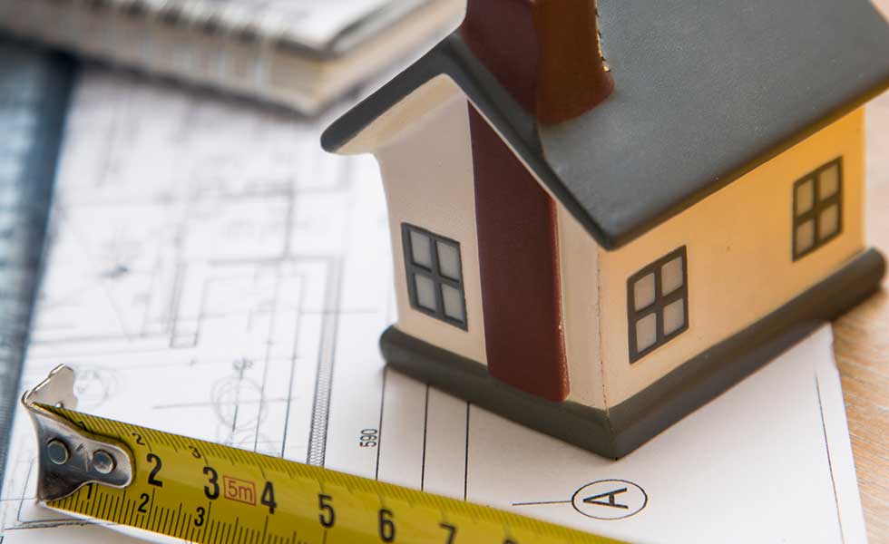 tender documents and tape measure