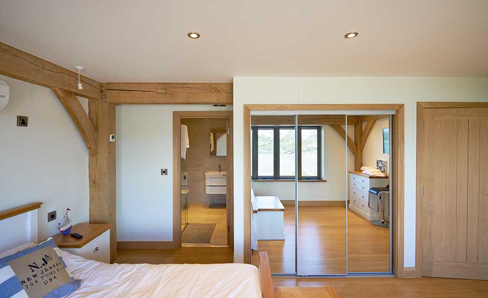 Master bedroom with en suite and exposed timber frame