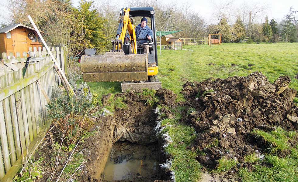archaealogical-dig-digging-trial-pits-with-mini-digger
