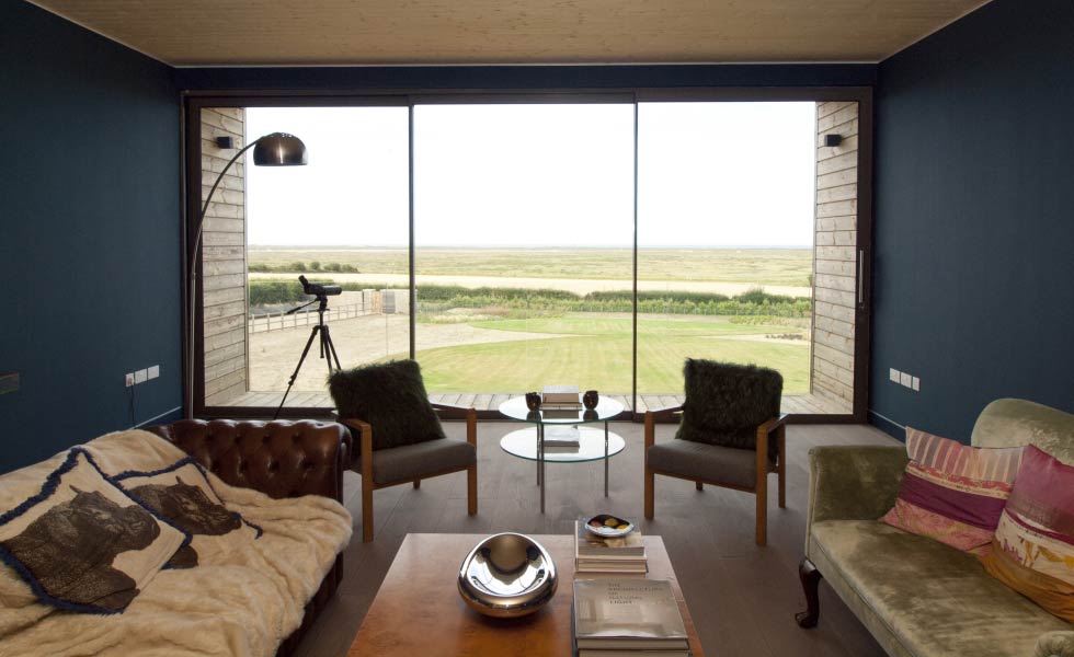 Yes glazing solutions The EDGE Ultra Slimline Sliding Doors blue walls sofas living room