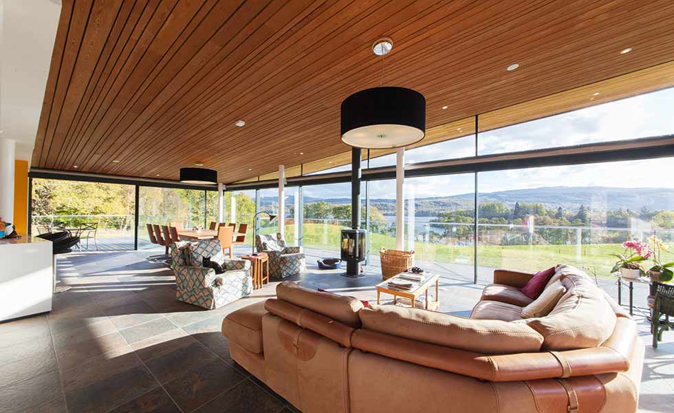 The ceiling of this living space designed by Alastair MacIntrye is clad in timber