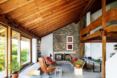 A considered palette of raw materials creates a midcentury modern feel in this living space