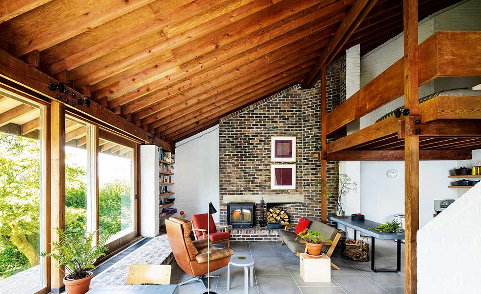 A considered palette of raw materials creates a midcentury modern feel in this living space