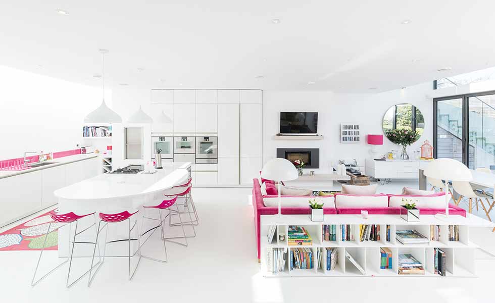 Clever furniture placement and lighting help to zone the spaces in this open plan living space