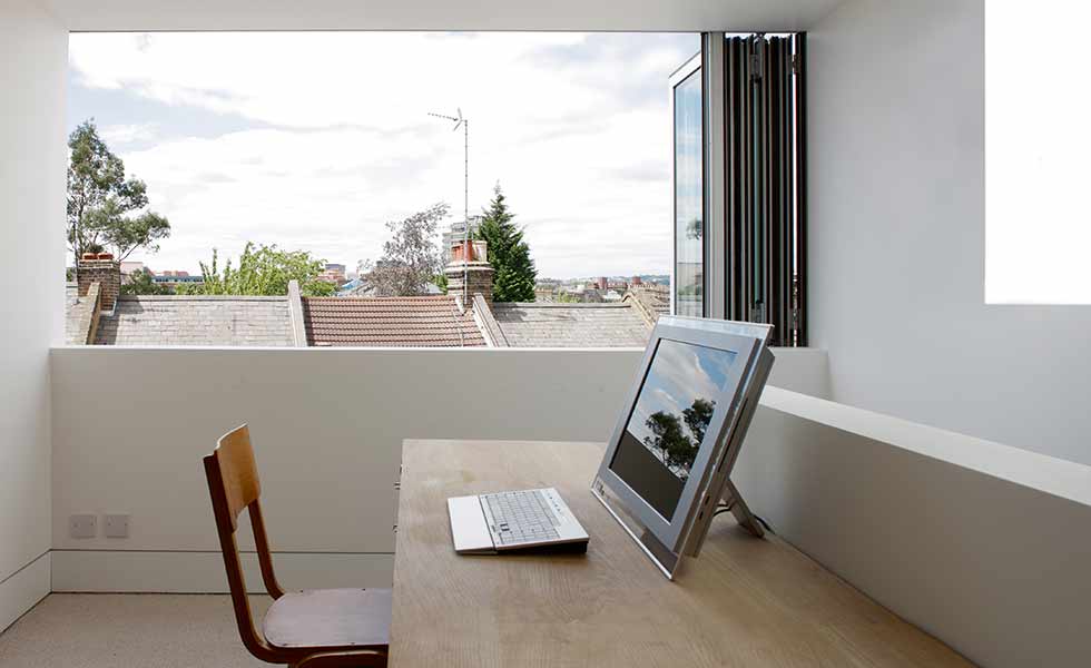 Bifold windows concertina back to open this home office to the outdoors