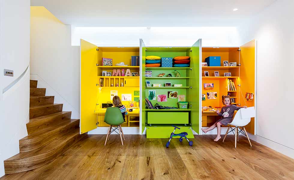In this project by architect Matt White, three homework areas have been built in to the walls for the children