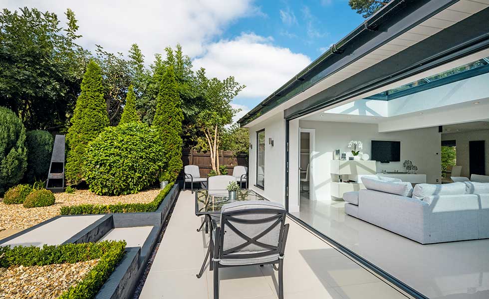 Garage conversion with sliding doors leading to terrace