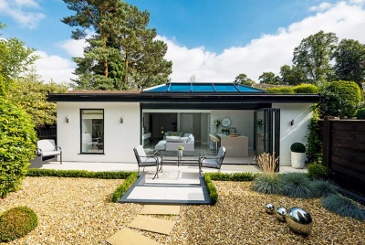 Contemporary garage conversion with bi-fold doors to the outside