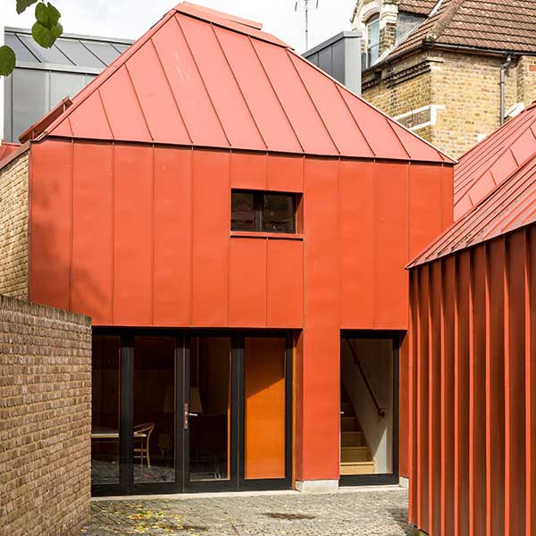 square orange contemporary home made from metal