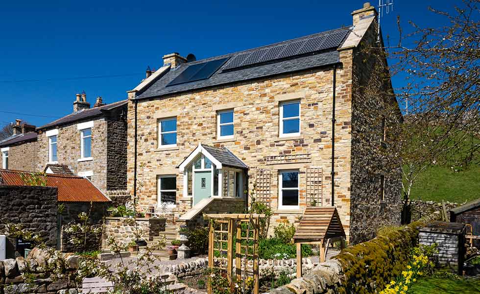 solar PV panels on this traditional style cottage make it eligible for feed in tariffs