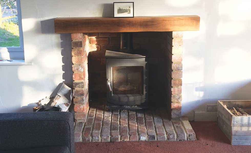 Jason opted for a more energy efficient woodburning stove
