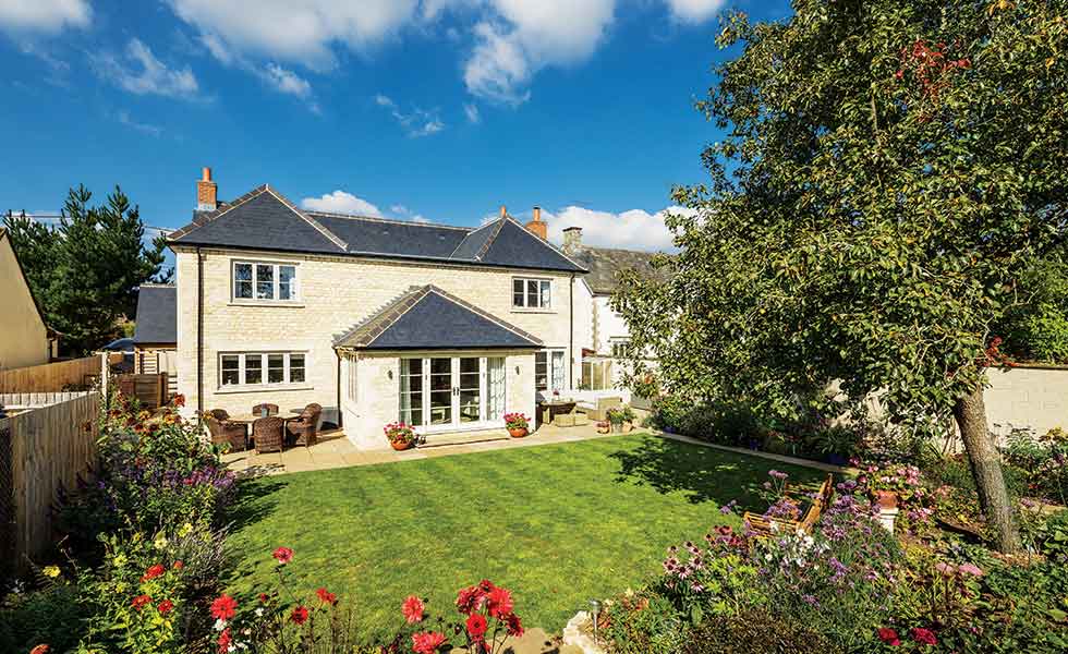 The rear of this package self build in the Cotswolds looks out over Toni and Andrew's established garden