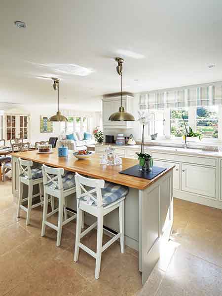 The kitchen in this Cotswold stone package build conforms to the self build's traditional style and was sourced locally