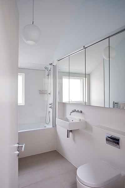 A simple white material palette has been adopted in this prefabricated home