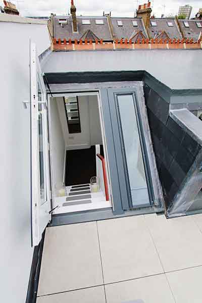 As well as a rear extension, a loft extension with roof terrace has also been added to this terraced home