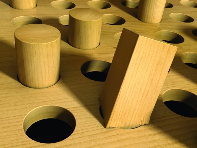 A square peg forced into a round hole.