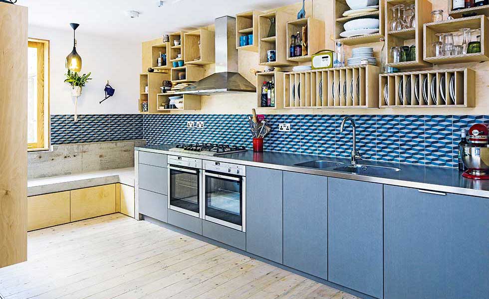 blue tiled kitchen with added value