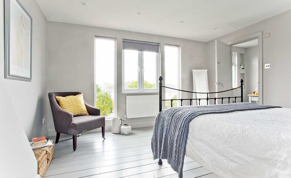 Floor-to-ceiling glazing maximises views in a loft conversion