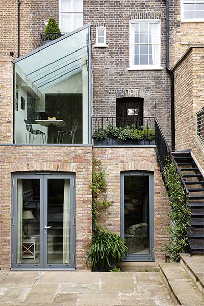 Two storey terrace house extension by Trombie