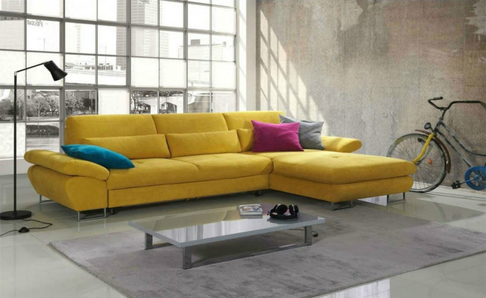 The Bardo Modern Fabric Corner Sofa Bed in yellow, includes storage and has a chaise lounge end. It costs £1,199.95