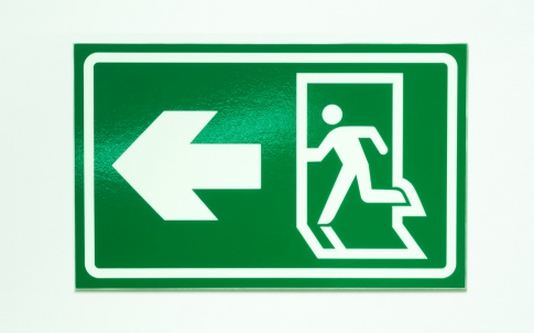 exit sign to denote person leaving