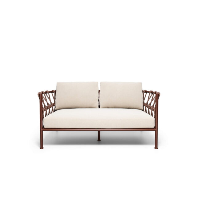 Inspired by the fluid lines and harmonious geometries of sea waves, the Antigua 2-seater sofa expresses an elegant and dynamic contemporary design. Its soft aluminum forms integrate with light steel mesh patterns, creating a designer sofa capable of communicating authenticity, movement, and visual lightness. Designed to offer a wide and welcoming seat, the Antigua 2-seater sofa conveys a sense of airiness and freedom, making it ideal for enhancing both outdoor and indoor environments. The aluminum structure—lightweight yet durable—guarantees longevity, ease of movement, and great versatility, making this outdoor sofa suitable for various residential and contract contexts. Comfort is enhanced by a system of ergonomic back cushions; these modular and enveloping cushions are designed to ensure optimal support and a superior relaxation experience. The Antigua 2-seater sofa represents a balanced synthesis of functionality, comfort, and high-end furniture design.