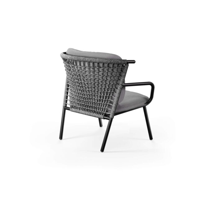 The Nef short-back lounge chair, designed by Patrick Norguet, draws inspiration from the graphic charm of hot air balloons, combining visual lightness, eclectic style, and structural solidity. The low backrest, adorned with an elegant synthetic rope weave, adds character and originality, while the aluminum frame and seat ensure durability and robustness. With a contemporary and refined design, Nef stands out for its versatility: perfect for both indoor and outdoor spaces, it harmoniously integrates into environments where materials, shapes, and colors interact, transforming every context into an elegant, dynamic, and cozy place, where comfort and style coexist naturally.
