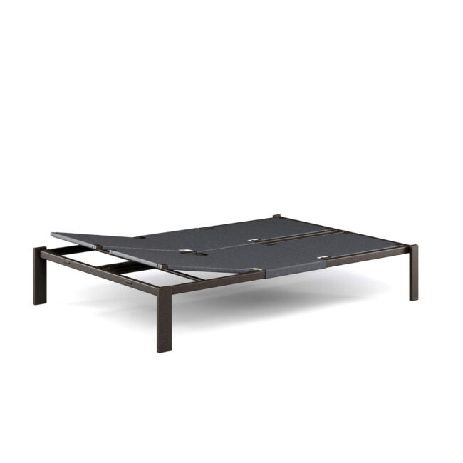 The Shine daybed, designed by Arik Levy, interprets outdoor relaxation in a contemporary key, becoming the star of terraces, pool edges, and refined gardens. Designed to share moments of quiet and well-being, it offers a spacious and welcoming area to stretch out in the sun, read, or simply let go to the slow rhythm of outdoor days. Its essential design is its distinctive feature: clean lines, light structure, and balanced proportions create a sober and elegant aesthetic, perfect for modern and minimalist contexts. The aluminum structure makes the Shine daybed ideal for both indoor and outdoor environments, ensuring resistance, lightness, and durability over time. The EMU-Tex fabric ensures comfort, breathability, and excellent performance even outdoors, maintaining a neat and elegant appearance. The adjustable backrest allows for personalized comfort, while the teak armrest details add a warm and natural touch, in harmonious contrast with the metal. The project is completed by the retractable wheels, which allow for easy movement without compromising the clean design aesthetic. A daybed designed to live relaxation naturally and stylishly, transforming every space into a sophisticated and timeless lounge area.