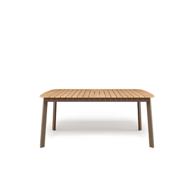 The Shine rectangular table, designed by Arik Levy and made of aluminum and teak, embodies a contemporary lifestyle made of simplicity and natural elegance. Designed to stylishly accompany everyday convivial moments, it perfectly adapts to open or minimalist spaces, creating a relaxed and welcoming atmosphere where design harmoniously blends with daily life. The clean and light lines define a sober but distinctive aesthetic, capable of naturally fitting into modern contexts, both residential and contract. The aluminum structure guarantees versatility and resistance, making the table suitable for both indoor and outdoor spaces. The large 166x100 cm teak top, elegant and textured, adds a warm and natural sensation, creating a refined dialogue with the metal. A detail that enriches the aesthetic and sensory experience, making the Shine table comfortable and pleasant to the touch.