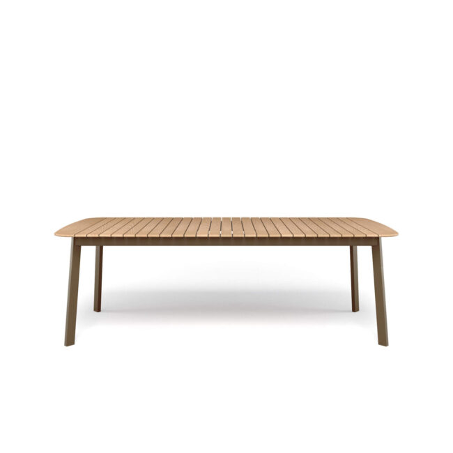The Shine rectangular table, designed by Arik Levy and made of aluminum and teak, tells a story of contemporary living made of simplicity and natural elegance, designed to stylishly accompany everyday convivial moments. Ideal for open or minimalist spaces, it helps create a relaxed and welcoming atmosphere, where design harmoniously integrates with daily life. The clean and light lines outline a sober but distinctive aesthetic, capable of naturally fitting into modern contexts, both residential and contract. The aluminum structure ensures versatility and resistance, making the table suitable for both indoor and outdoor environments. The 225x100cm teak top introduces a warm and natural note, creating a refined contrast with the metal. A detail that enhances the aesthetic and sensory experience, making the table a central element for authentic and timeless convivial moments.