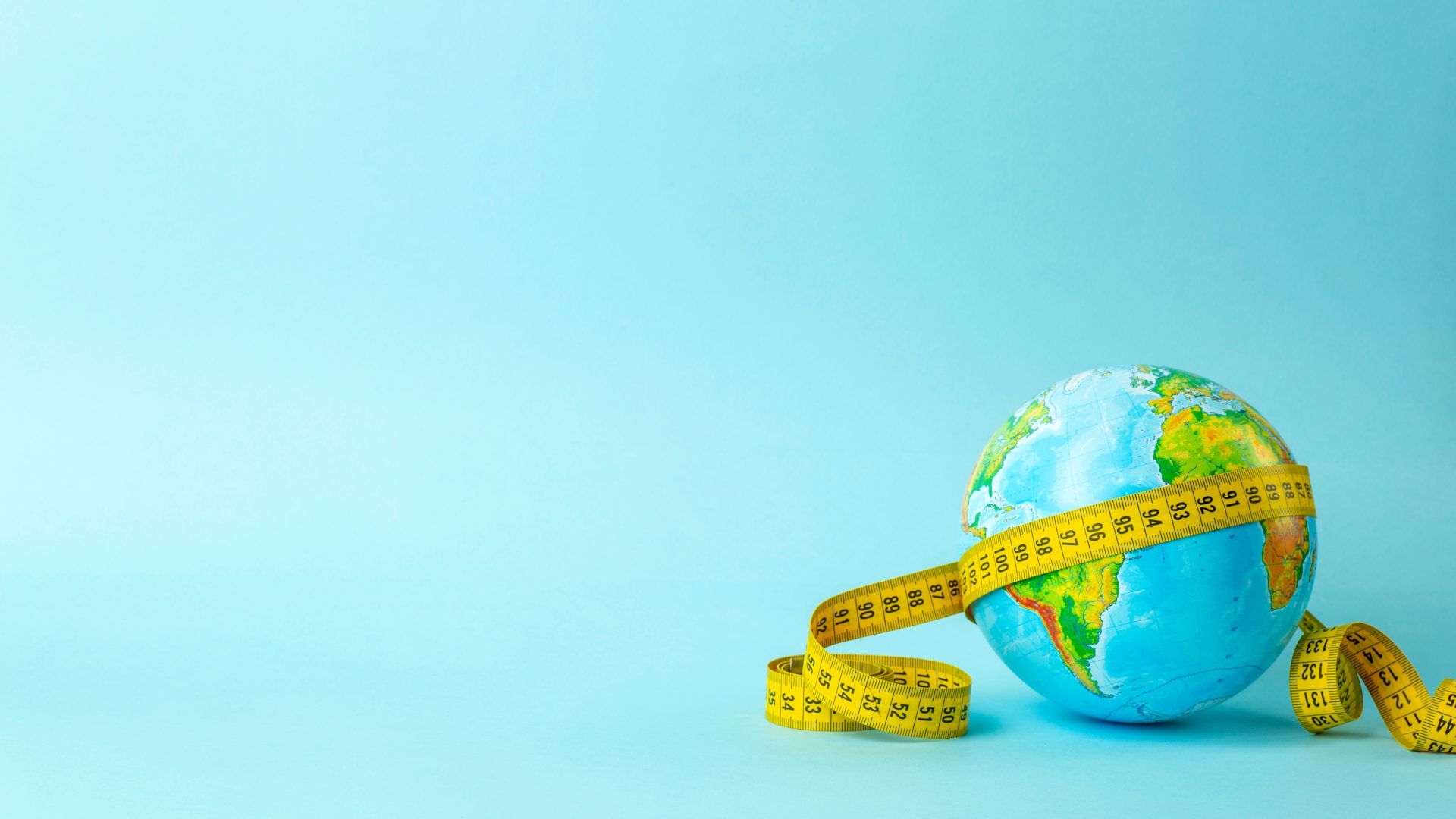 plaatje van wereldbol met meetlint