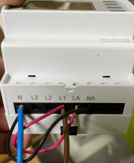 A white box with wires 
AI-generated content may be incorrect.
