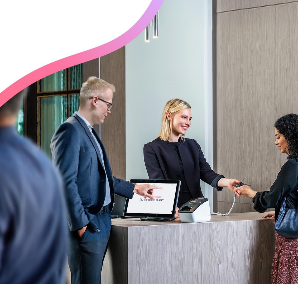 Systam Lite self-service kiosk at a reception desk