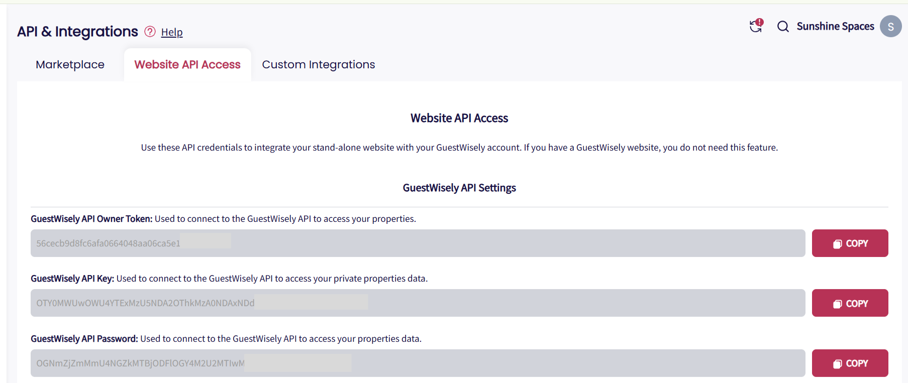 Screenshot showing the GuestWisely Website API Access section with API credentials, including API Owner Token, Key, Password, and Username, used to securely connect and sync property data with a standalone website.