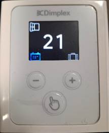 A white electronic device with buttons and a screen
AI-generated content may be incorrect.