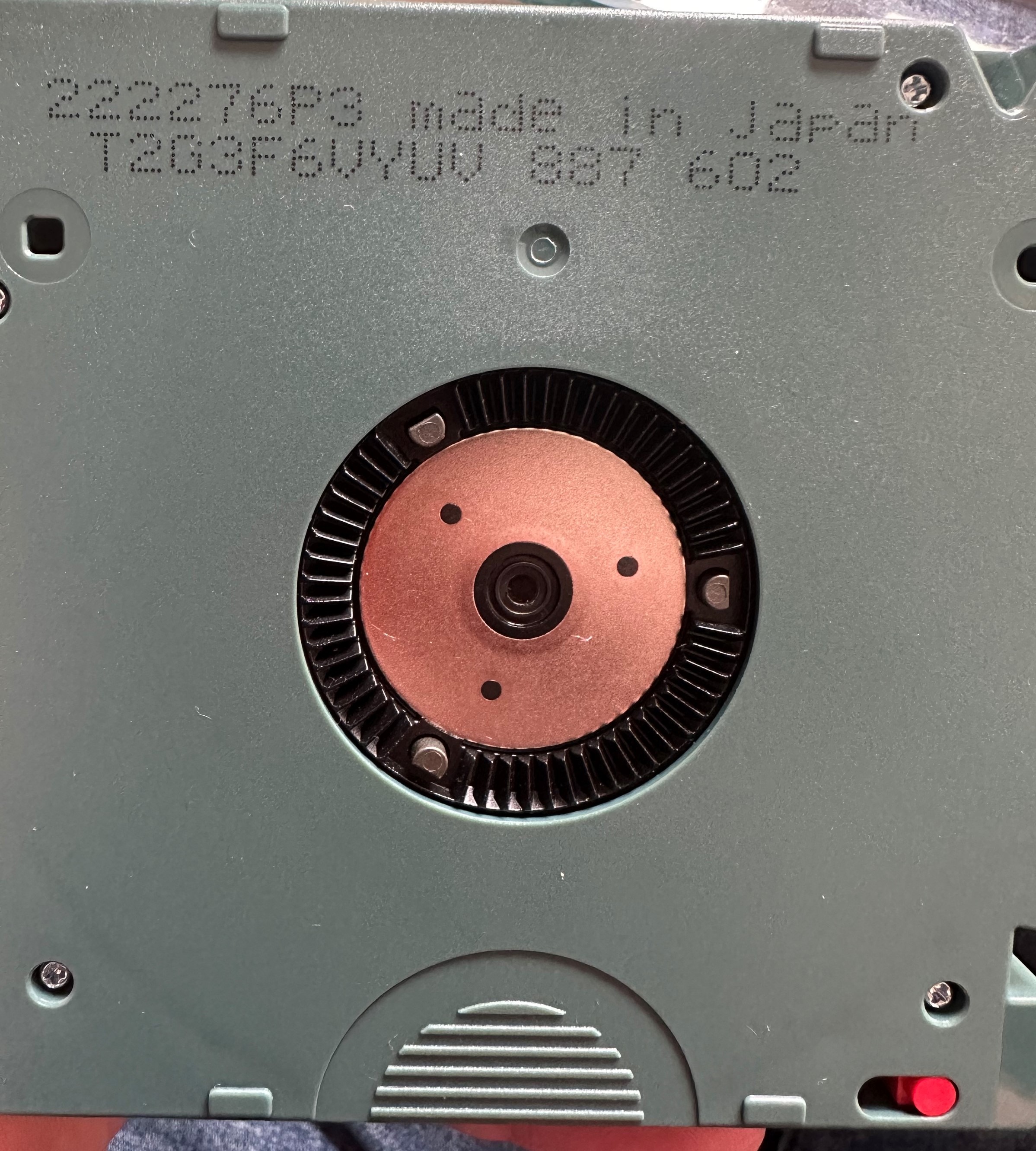 Underside of an LTO cartridge showing the printed serial number T2G3F6VYUV