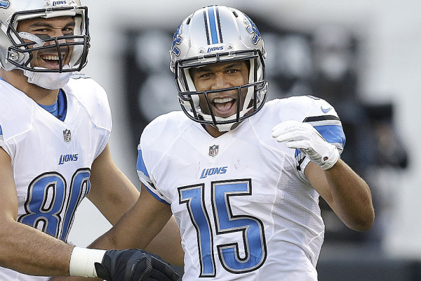Detroit Lions wide receiver Golden Tate (15) celebrates after scoring on a 28-yard touchdown reception with tight end Joseph Fauria during the first quarter of an NFL preseason football game against the Oakland Raiders in Oakland, Calif., Friday, Aug. 15, 2014. (AP Photo/Ben Margot)
