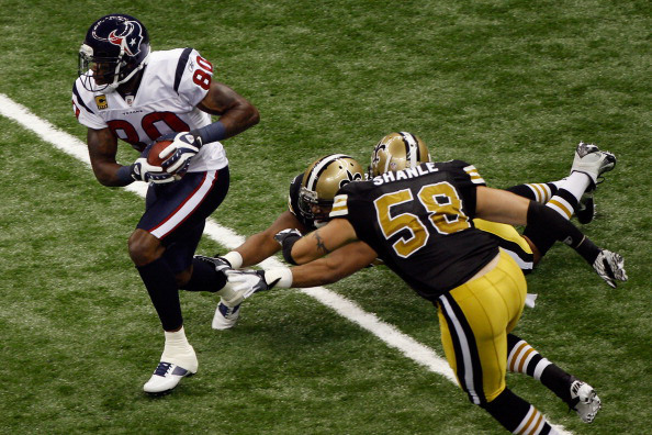NEW ORLEANS, LA - SEPTEMBER 25: Andre Johnson #80 of the Houston Texans avoids a tackle by Scott Shanle #58 of the New Orleans Saints at Louisiana Superdome on September 25, 2011 in New Orleans, Louisiana. (Photo by Chris Graythen/Getty Images)