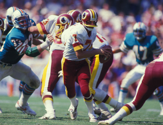Washington Redskins Joe Theismann (7) in action during a game against the Miami Dolphins at the Orange Bowl in Miami, Florida. Joe Theismann played for the Washington Redskins from 1974-1985(AP Photo/David Durochik)