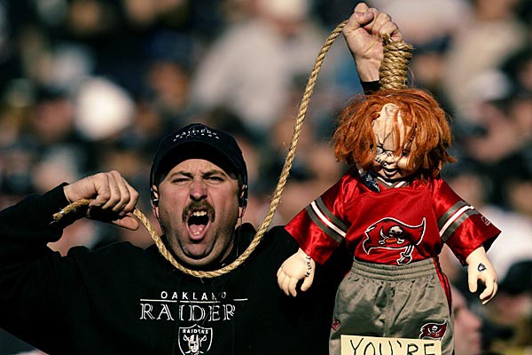 OAKLAND, CA - JANUARY 19: An Oakland Raiders fan hold up a Chucky doll emblematic of Jon Gruden in anticipation of a match up with Gruden's Tampa Bay Buccaneers prior to the start of the AFC Championship game against the Tennessee Titans at Network Associates Coliseum on January 19, 2003 in Oakland, California. The Raiders defeated the Titans 41-24, sending them on to the NFL title game for the first time since 1984. (Photo by Brian Bahr/Getty Images)