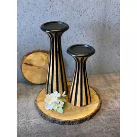 Portavelas de color negro y natural