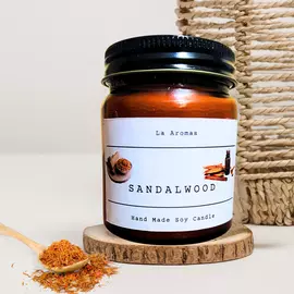 Vela perfumada de sándalo en tarro de ámbar