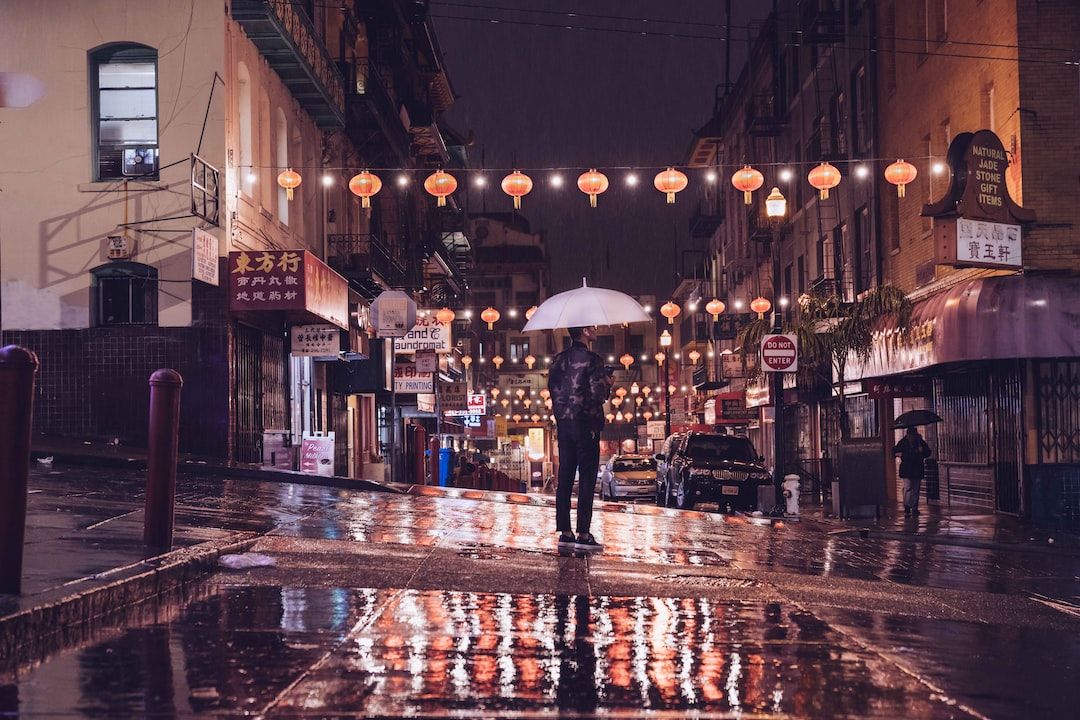 So last night my car overheated and I had to pull over and see if it would cool down in the rain. within 20 min my battery died so I then had to call my roadside assistance to come jump my car. I steppe outside when I saw this young man down the street in the rain. I hurried to him and was able to capture this shot!