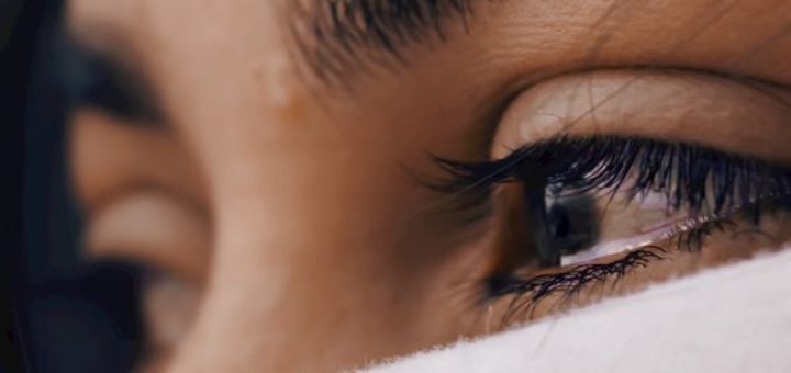 woman with teary eyes crying