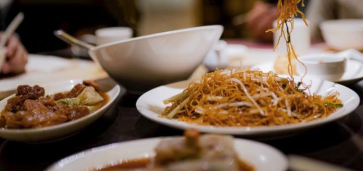 chinese food on table with chopsticks